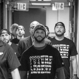 Brian Rogers walking out to the cage with his team